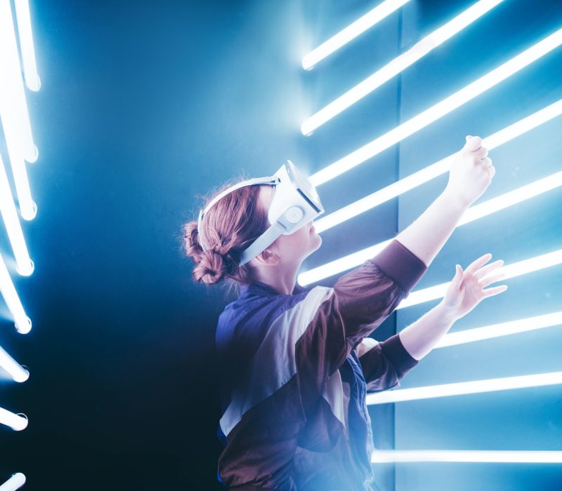 girl-using-vr-goggles-in-colorful-neon-lights.jpg